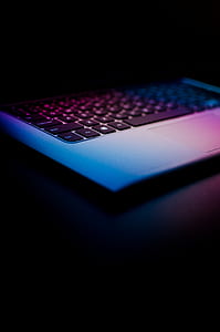 gray and purple laptop on black surface thumbnail
