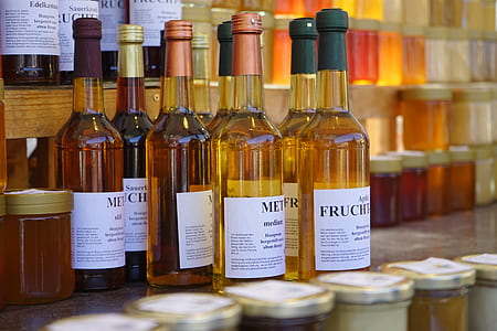 selective focus photography of pile of bottles thumbnail