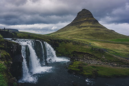 waterfalls beside mountain thumbnail