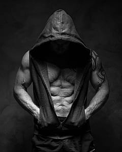 man wearing hooded vest on grayscale photo thumbnail
