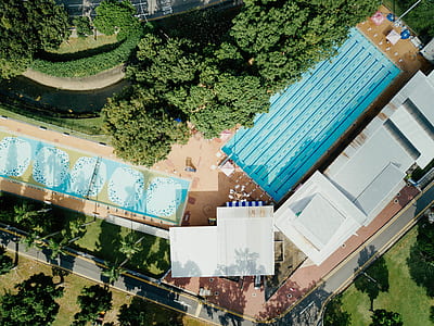 bird's eye view photography of pool and trees thumbnail
