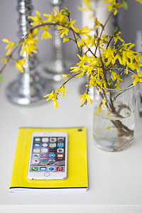 White smartphone with yellow flowers thumbnail