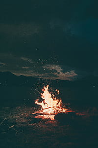 Lit Bonfire Outdoors during Nighttime thumbnail