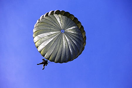 man riding parachute during daytime thumbnail