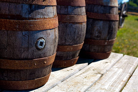 three brown wooden barrels on brown wooden surface thumbnail