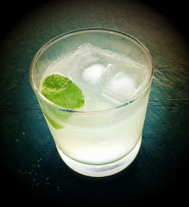 drinking glass filled with water and ice cubes thumbnail