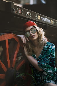 Woman Leaning on Red Wheel thumbnail