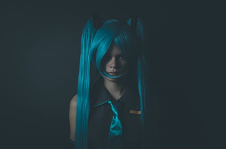 person wearing blue wig and blue necktie thumbnail