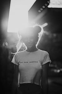 greyscale photo of woman wearing white top thumbnail