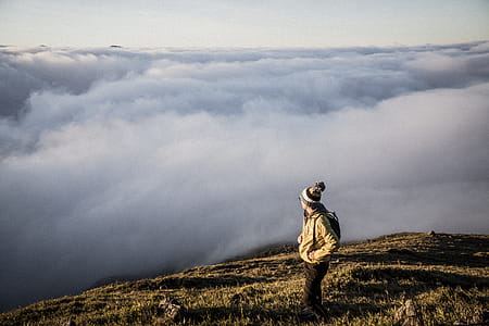 Man Standing on Top of Moutain thumbnail