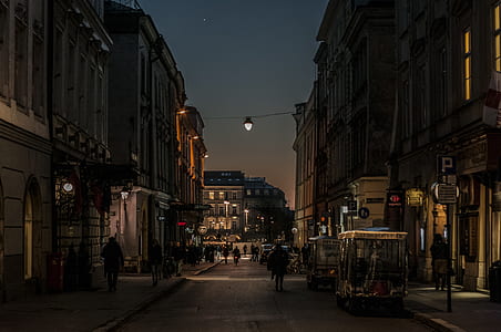 people walking in an alley during nighttime thumbnail