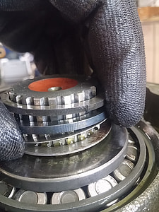 person putting spacer on gear thumbnail