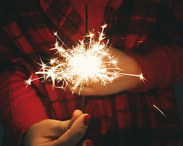 person holding fire cracker thumbnail