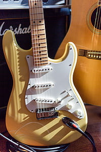 yellow and white electric guitar thumbnail