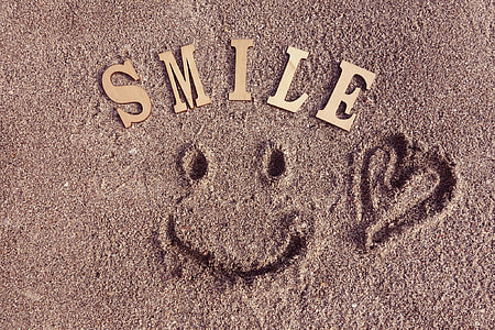 Smile cutaway decors on brown sand thumbnail