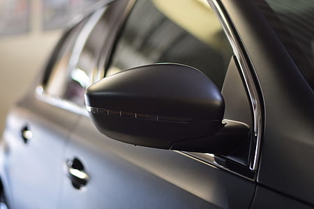 selective focus photography of vehicle wing mirror thumbnail