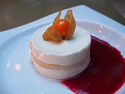 white icing-covered cake on square white plate thumbnail