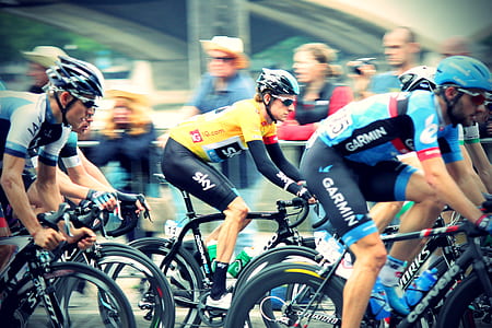group of cyclists during daytime thumbnail