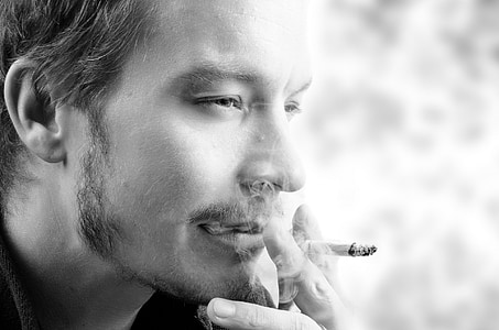grayscale photography of man smoking thumbnail