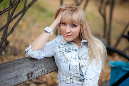 selective focus photo of woman sitting on bench white leaning thumbnail