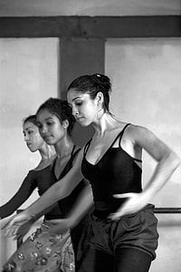 grayscale photo of three women dancing thumbnail