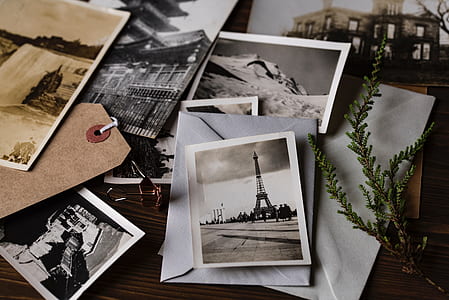 grayscale photos on brown wooden surface thumbnail