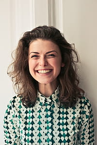 Portrait Of Young woman in printed collared shirt seen smiling as looking at camera thumbnail