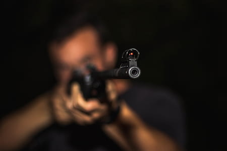 Photo of Man Holding Rifle thumbnail
