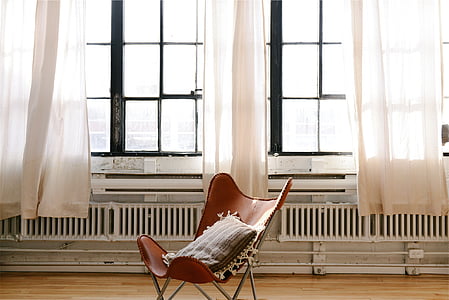 brown and gray chair near window thumbnail