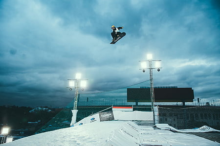 man riding snowboard doing trick thumbnail