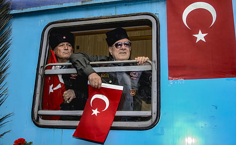 soldier holding flag of Turkey in train thumbnail