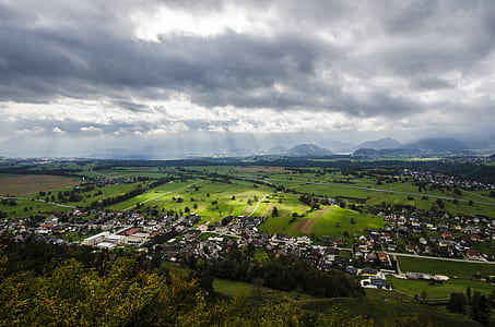 aerial photography of village under white cloudy sky at daytime thumbnail