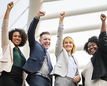 three women and one man raising their left hands thumbnail