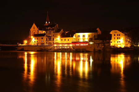 building near body of water photograph during nighttime wallpaper thumbnail