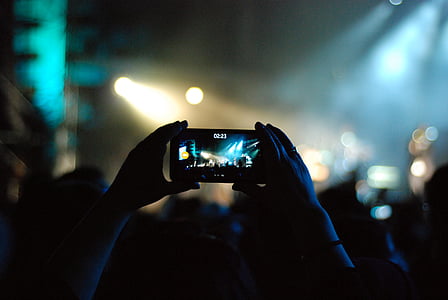 photo of person holding smartphone thumbnail
