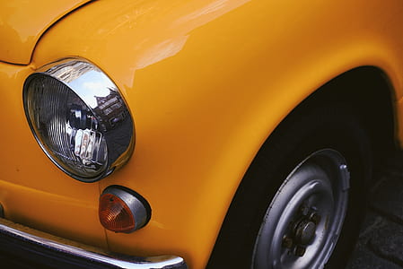 closeup photo of orange car thumbnail