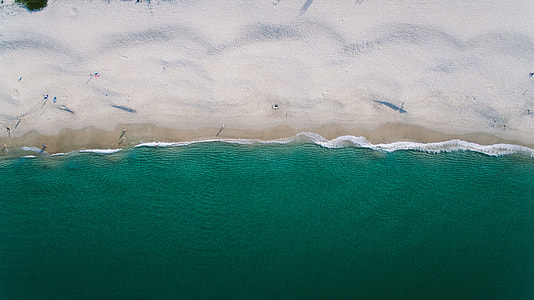 landscape photo of green sea and brown sand thumbnail