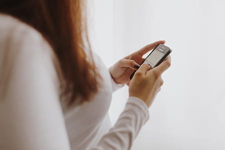 Beautiful young woman using smartphone thumbnail