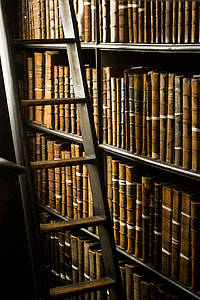 brown wooden ladder near book lot thumbnail