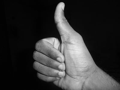 grayscale photo of okay hand gesture thumbnail