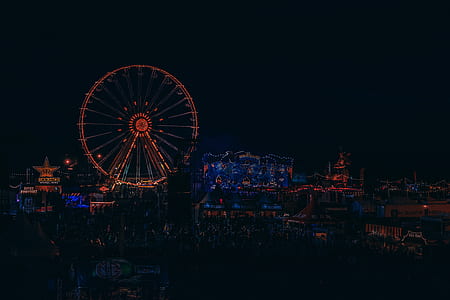 Cityscape photo of amusement park during nighttime thumbnail