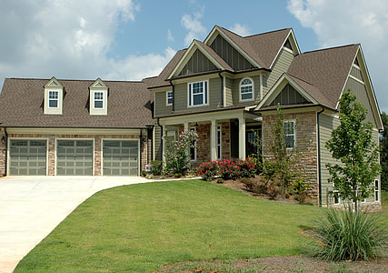 gay and white concrete house under cirrus clouds thumbnail