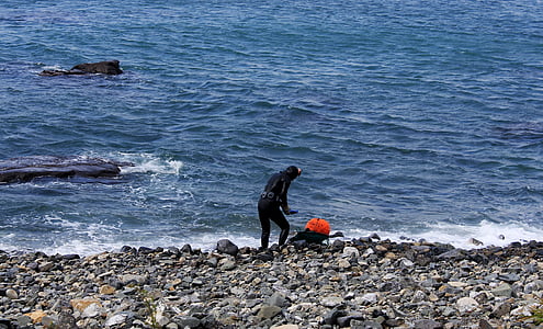 person standing near seashore thumbnail