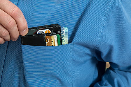 person holding black card holder thumbnail
