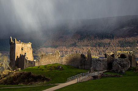 landscape photography of stone castle near trees thumbnail