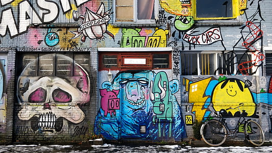 photography of wall building with graffiti painting thumbnail
