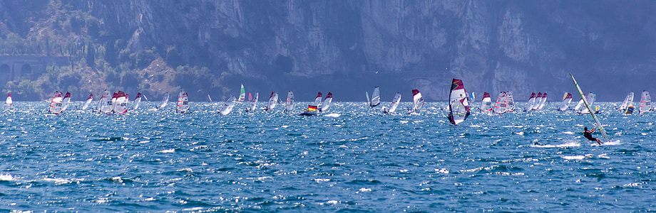 sailing boat on blue body of water during daytime thumbnail