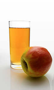 red apple fruit beside clear glass drinking cup thumbnail