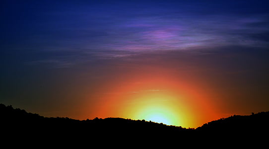 silhouette of trees and mountain thumbnail