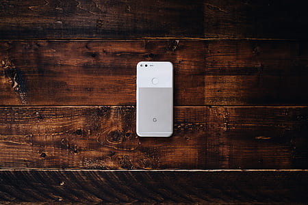 very silver Google Pixel 2 XL smartphone on brown surface thumbnail